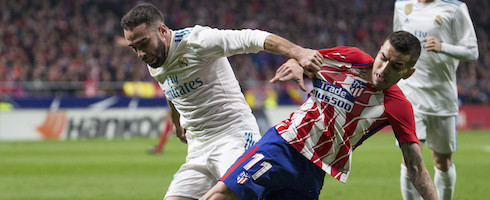 Real Madrid's Dani Carvajal vies with Angel Correa of Atletico Madrid