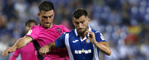 Espanyol's Leo Baptistao fends off Sergio Postigo of Levante