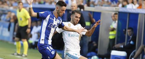 Real Madrid's Dani Ceballos vies with Burgui of Alaves