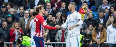 Atletico Madrid forward Antoine Griezmann with Real Madrid's Sergio Ramos