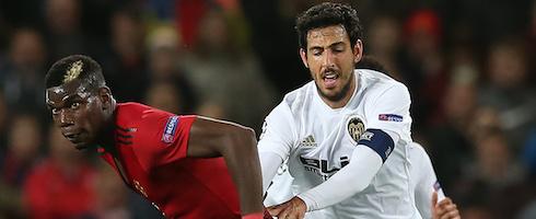 Manchester United's Paul Pogba tussling with Dani Parejo of Valencia