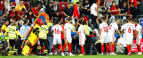 Sevilla players look on as fence collapses at Ipurua