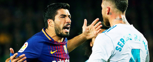 Barcelona's Luis Suarez argues with Sergio Ramos of Real Madrid