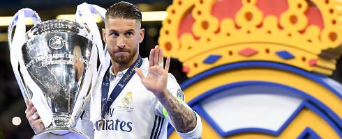 Real Madrid's Sergio Ramos holding the Champions League