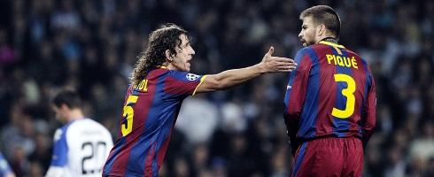 Barcelona defender Carles Puyol and Gerard Pique