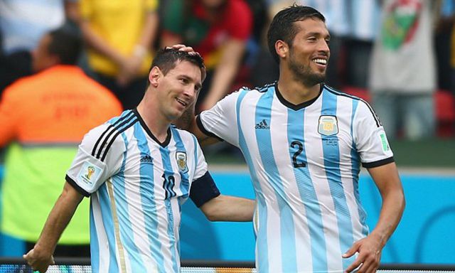 Lionel Messi and Ezequiel Garay