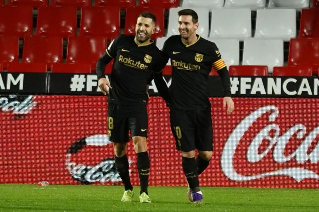 Barcelona's Jordi Alba and Lionel Messi