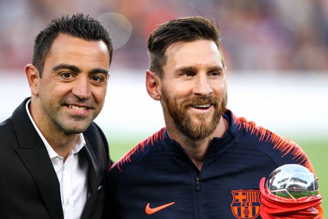 Xavi Hernandez and Lionel Messi