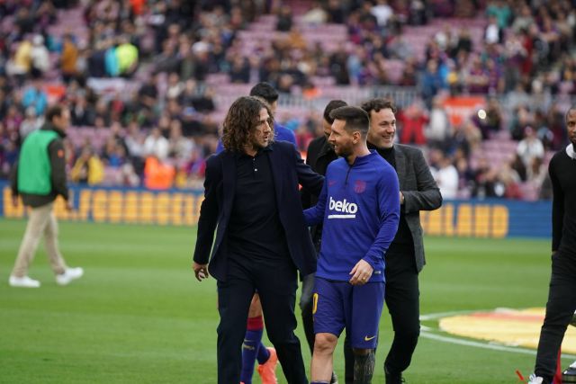 Carles Puyol and Lionel Messi