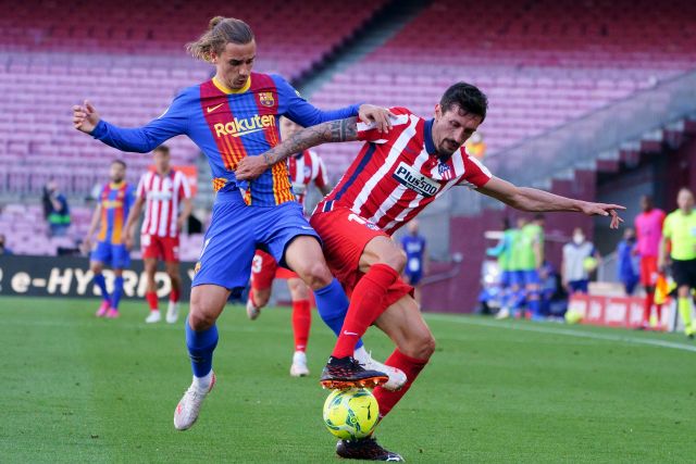 Antoine Griezmann and Stefan Savic