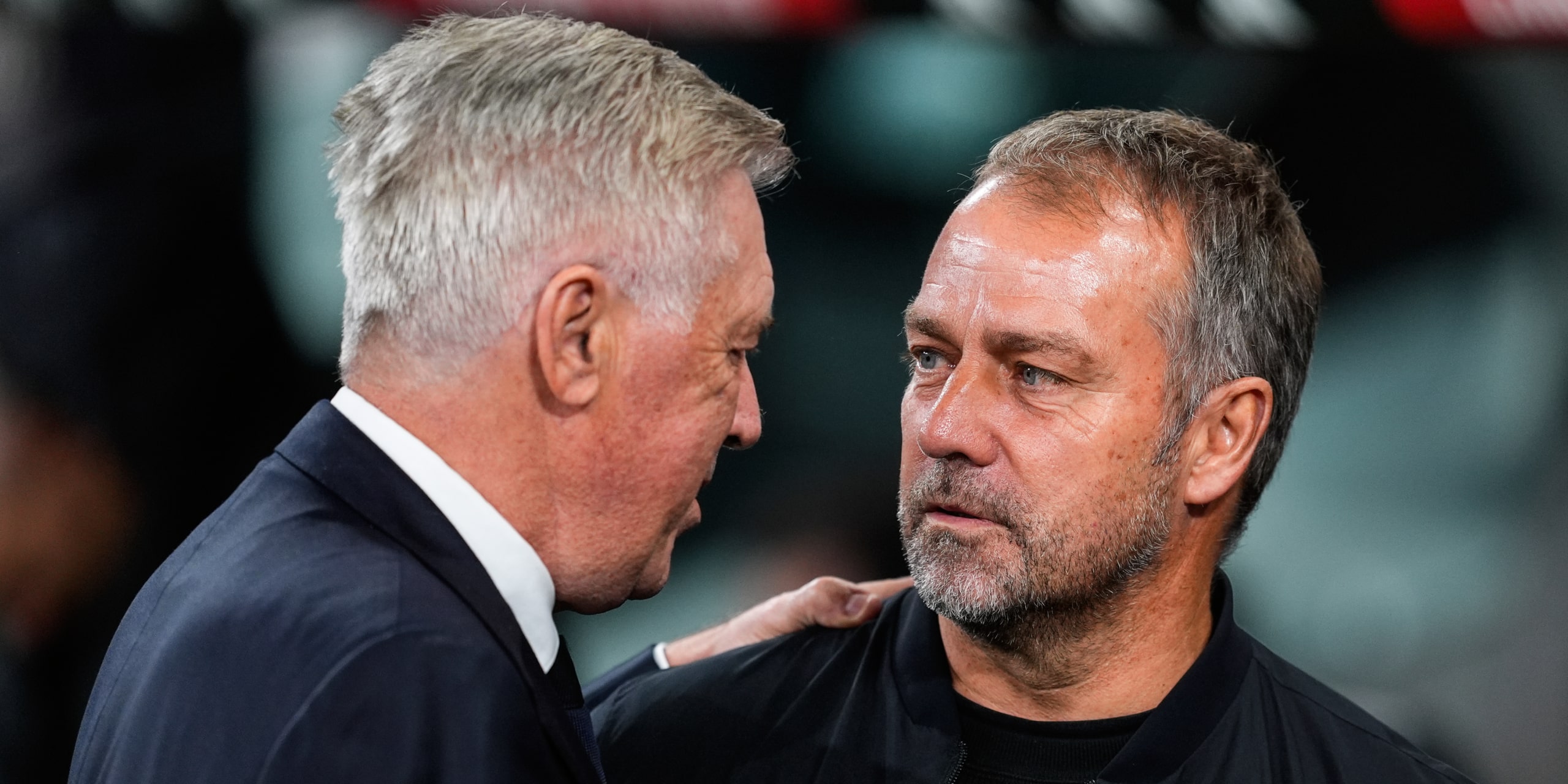 Carlo Ancelotti greets Hansi Flick.