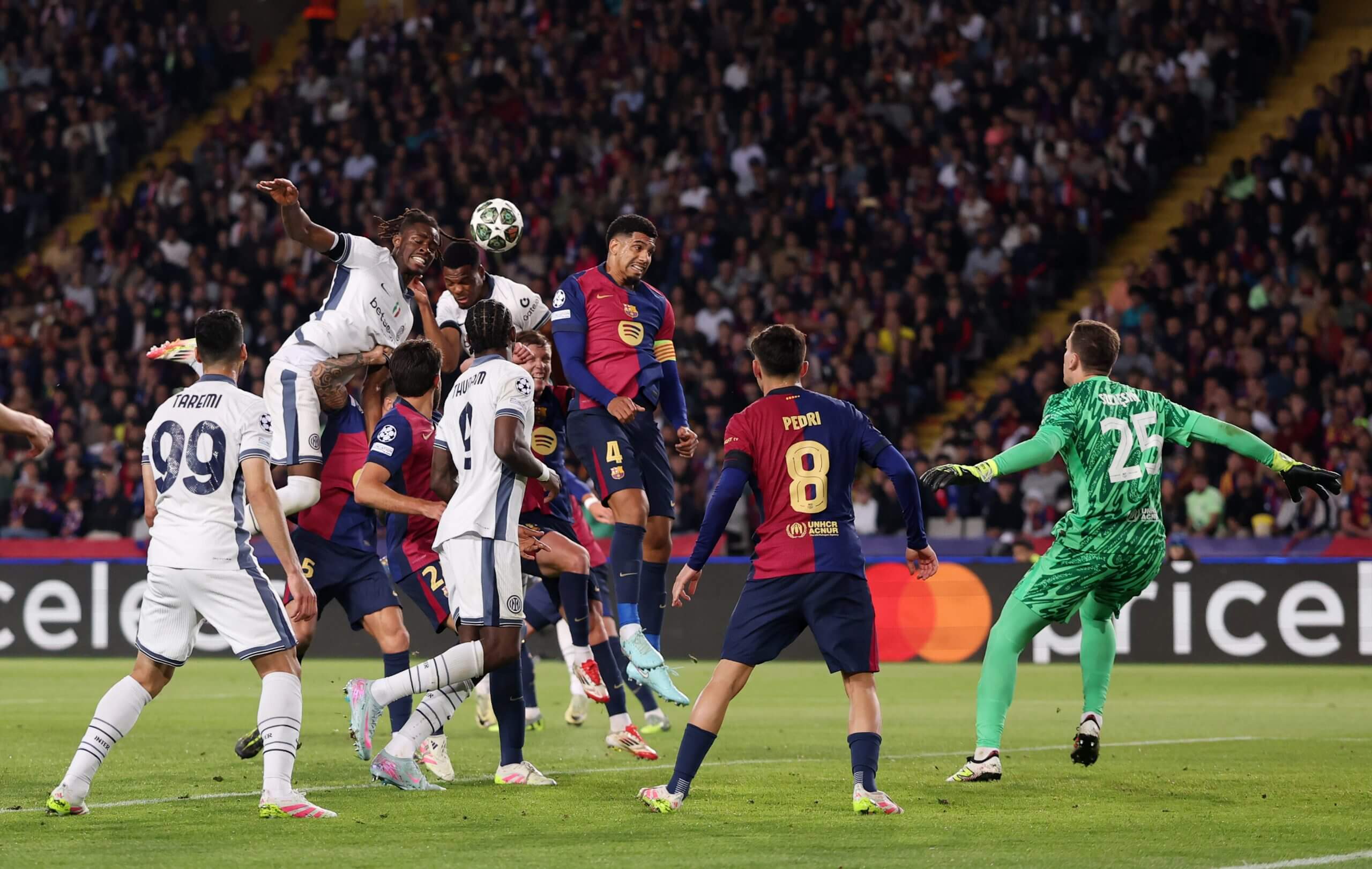 Dumfries heads home from a corner against Barcelona.