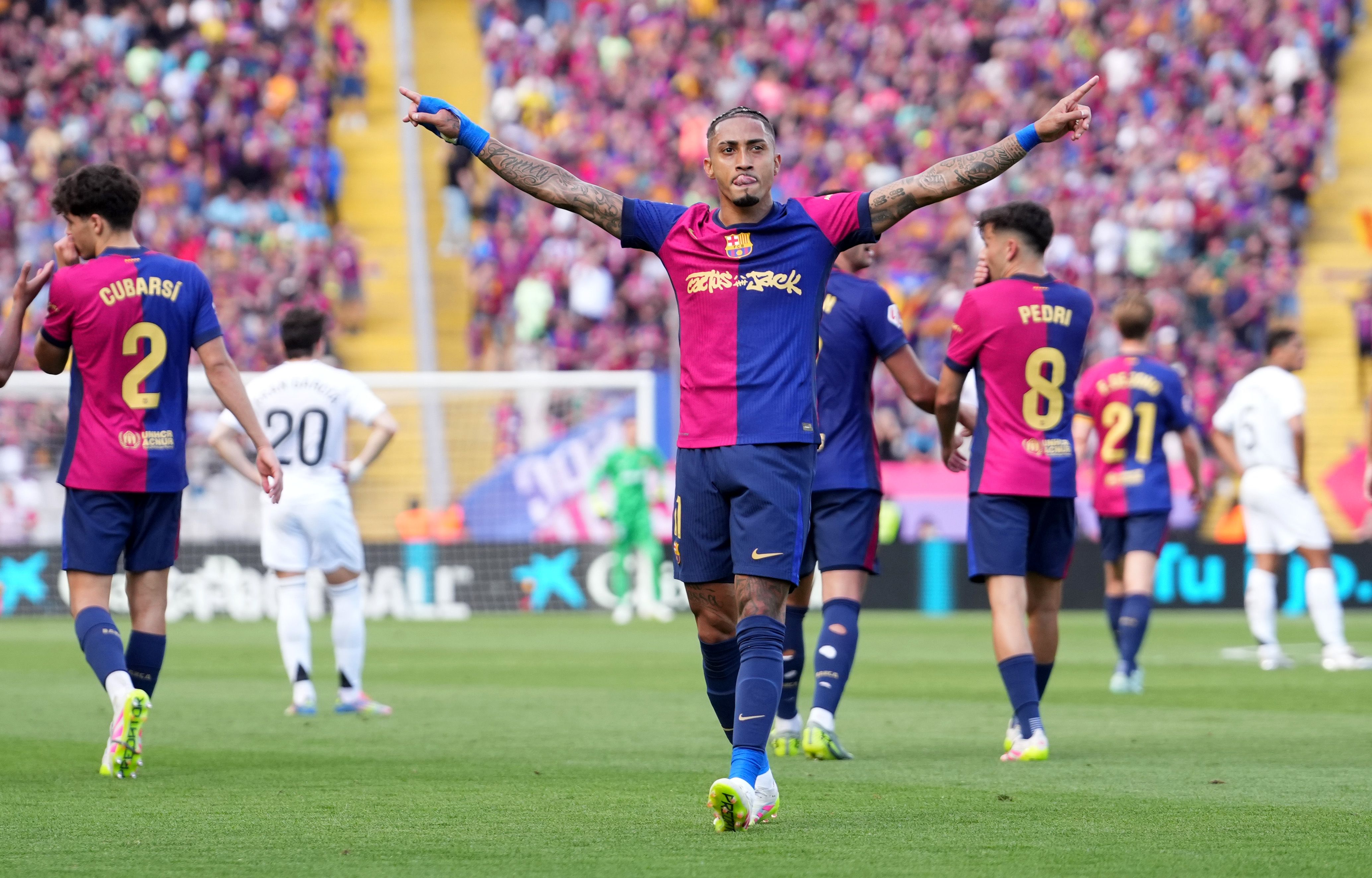 Raphinha celebrates a goal during El Clasico