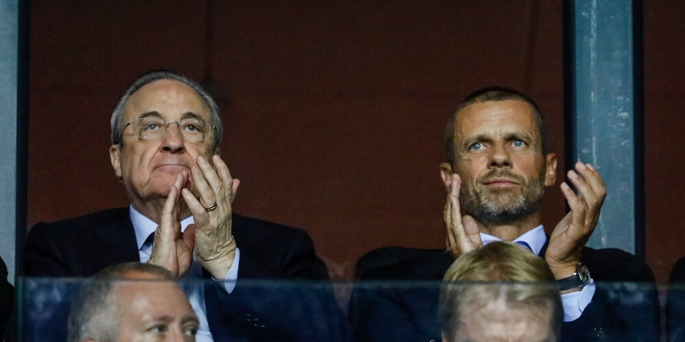 Ceferin and Perez sit together in silence.