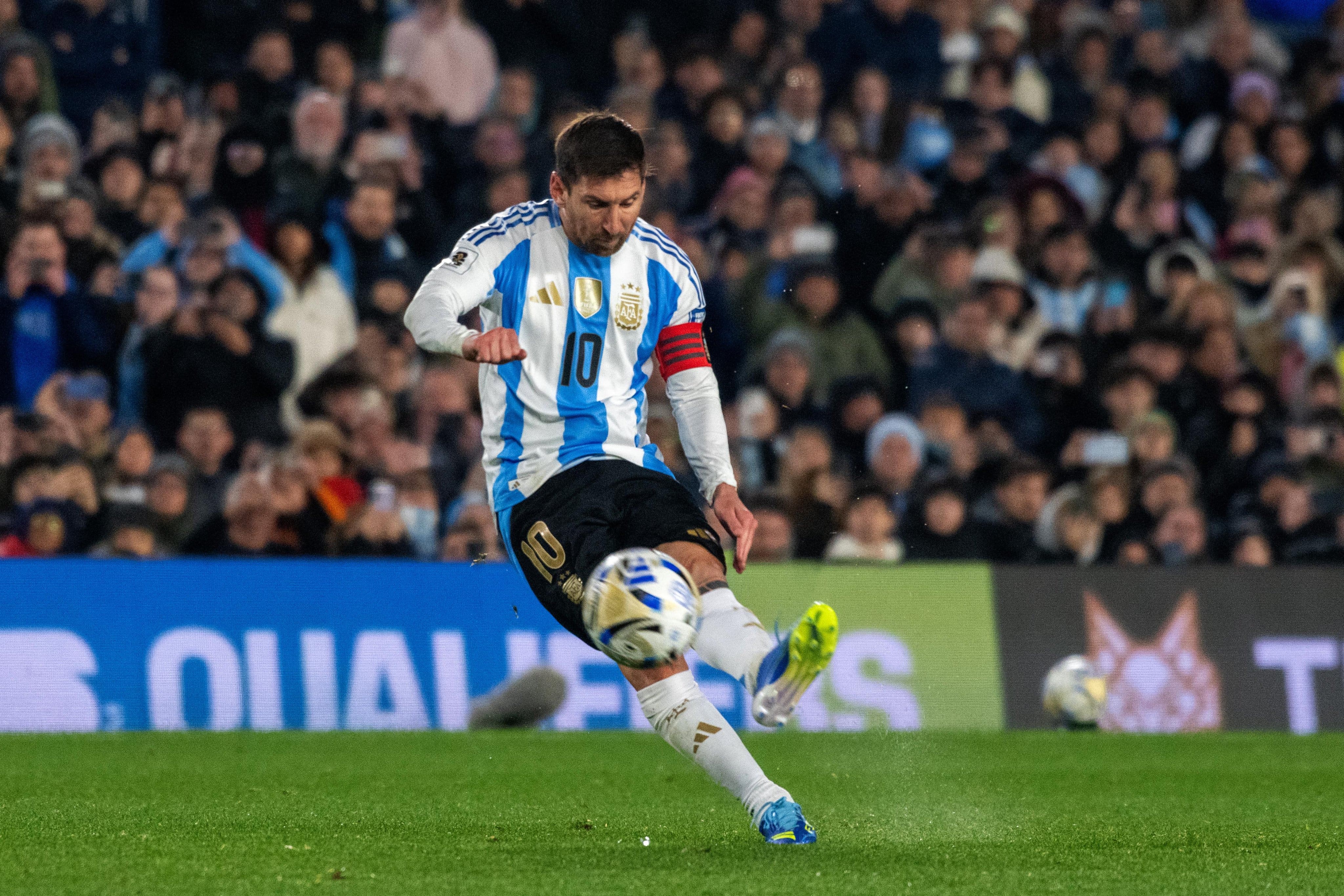 Messi strikes the ball for Argentina.