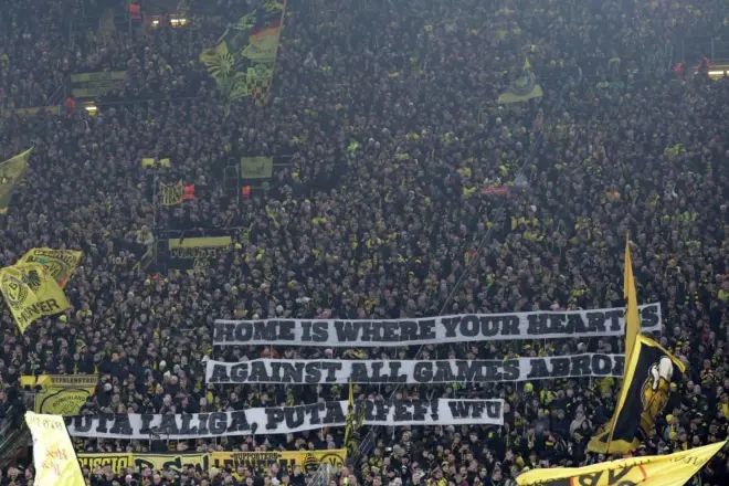 Dortmund fans protest Liga game abroad.
