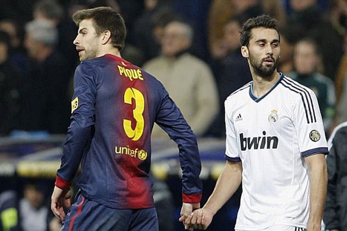 Pique and Arbeloa in a Clasico.